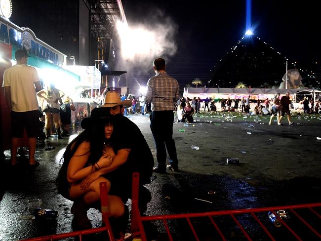 Attendees of the Harvest Country Music Festival take cover. Picture: Getty