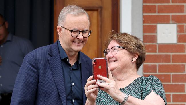 Labor leader Anthony Albanese stops for a selfie outside St Monica’s Cathedral in Cairns. Picture: Toby Zerna