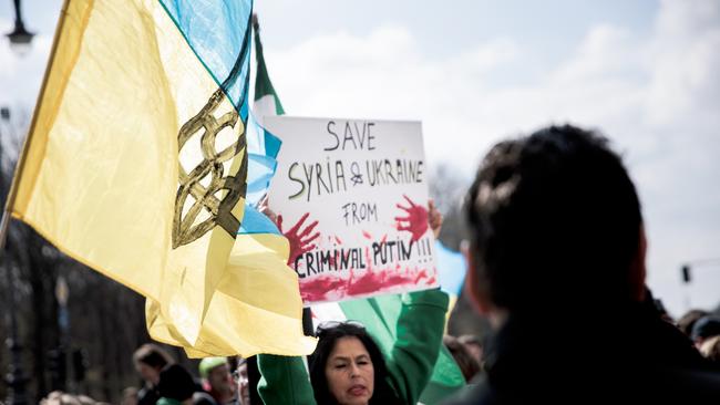 Anti-Putin protesters at the Brandenburg Gate in Berlin this month. Picture: Getty Images