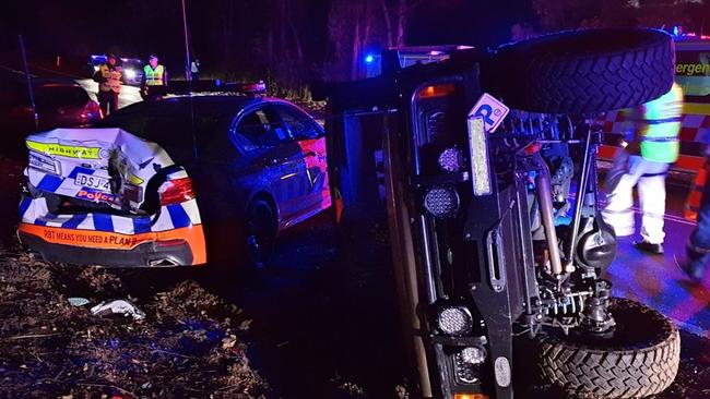 The Highway Patrol BMW was badly damaged after a Land Rover ran into the back of it. Picture: NSW Police