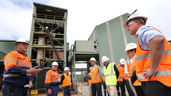 Diversified Minerals General Manager David Pelchen, far left, and Tasmanian Premier Will Hodgman, right, during a tour of the Henty Gold Mine. Picture: CHRIS KIDD