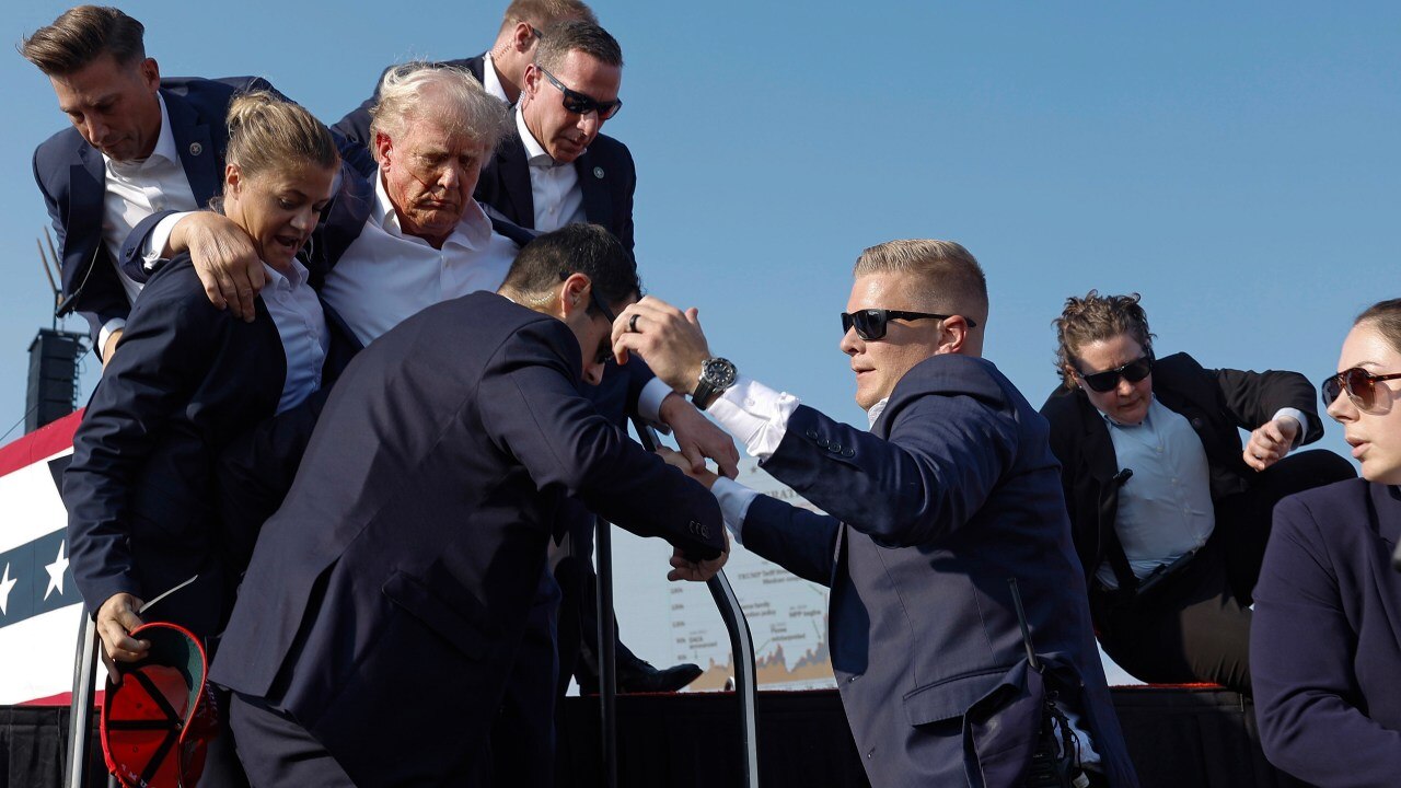 Republican presidential candidate former President Donald Trump is rushed offstage by U.S. Secret Service agents. Picture: Getty.