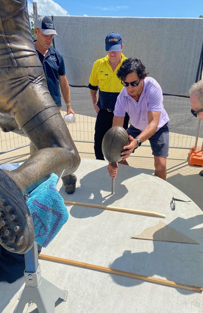 Johnathan Thurston gets an early look at his statue outside the new Townsville Stadium.