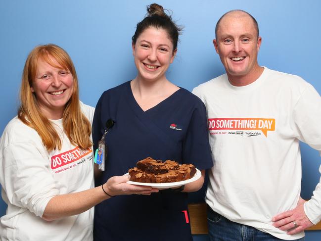 Journalists Fiona Killman (eft) and Richard Noone (right) with nurse Sophie Walker (centre) on Dosomething Day. Picture: AAP /Sue Graham.