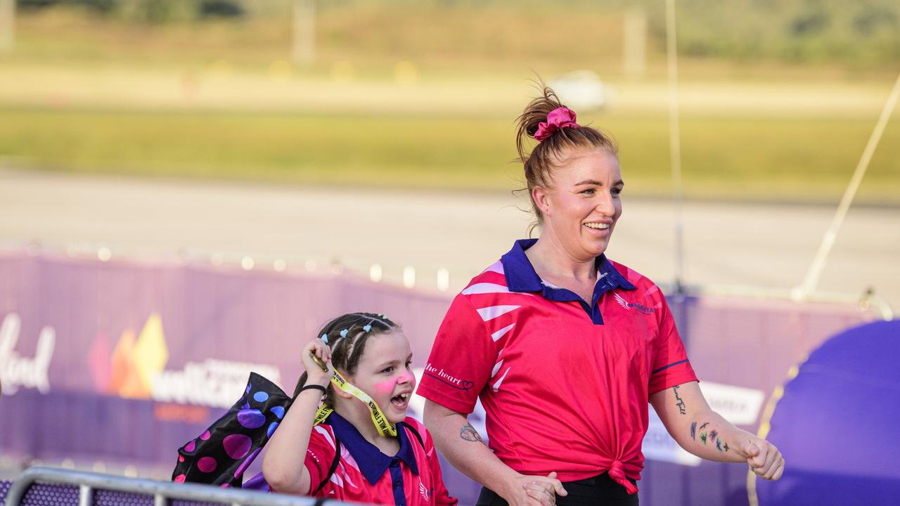 Scarlette Morey (left) and Amber Grandison finish the Runway Mile for team Magenta Toowoomba Marathon events at Wellcamp Airport, Saturday, May 3, 2025. Picture: Kevin Farmer