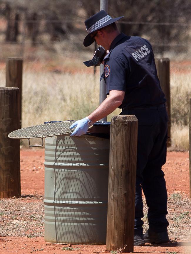 Forensic investigators analyse the scene in Aileron. Photo: Jeff Tan