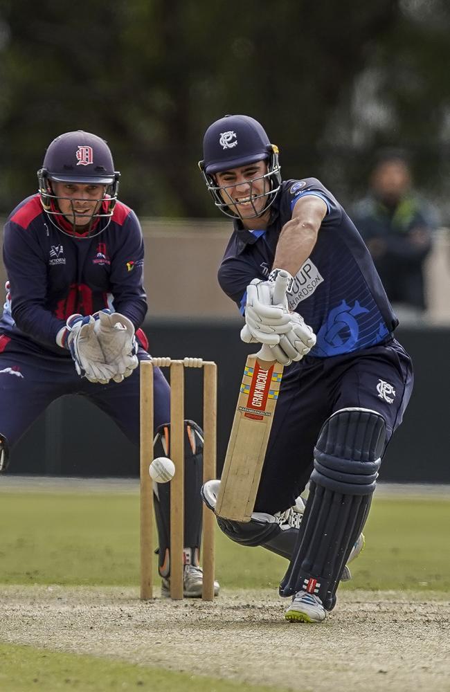 Dandenong keeper Jacques Augustin watches as Prahran batsman Damon Egan defends.