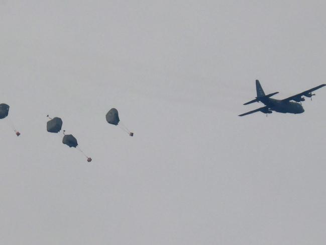 A Jordanian military aircraft drops humanitarian aid over Rafah in the skies of the southern Gaza Strip. Picture: AFP