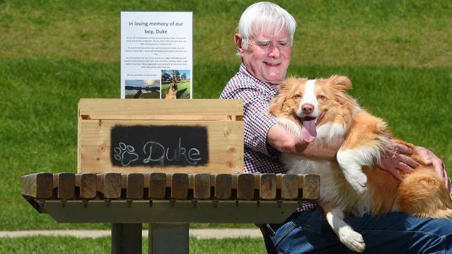 Lilydale resident Richard Knight, with his dog Jack, pay tribute to Duke. Picture: Josie Hayden