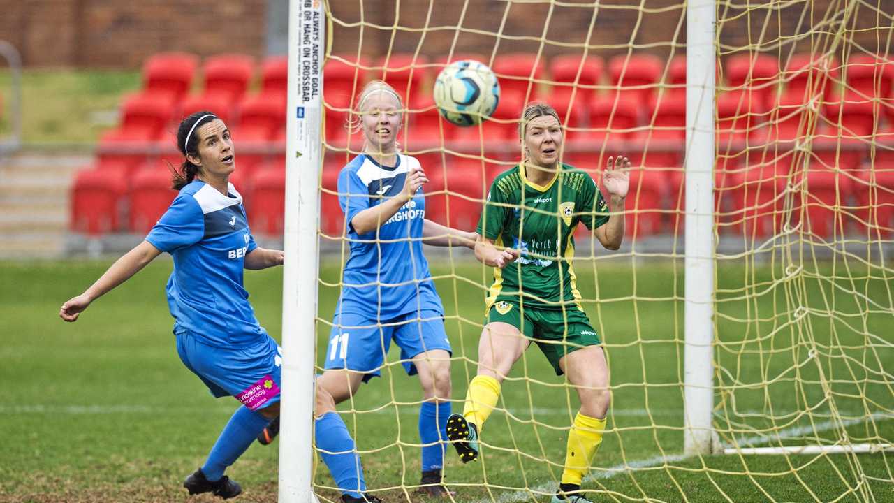 AT THE DOUBLE: Thunder striker Louise Rolfe scores one of her two goals against Mitchelton. The Thunder women lost the match 3-2. Picture: Nev Madsen