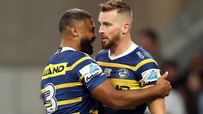 Clint Gutherson celebrates scoring a try with Eels teammate Michael Jennings during Sunday’s win over the Dragons. Picture: Getty Images