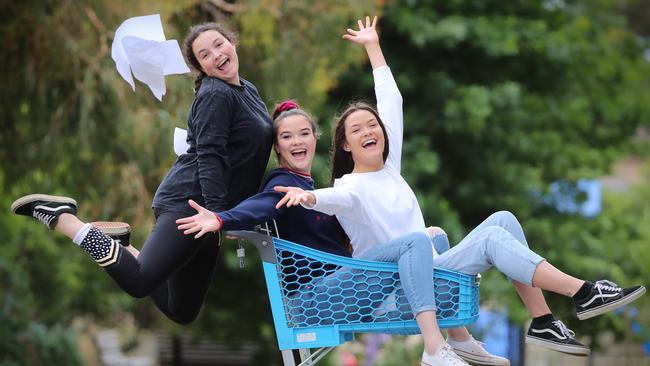 Triplets Erin, Keely and Jordan Plymin get their VCE results after graduating from Wantirna College. Picture: Alex Coppel