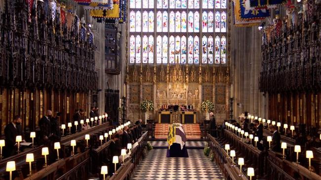 Harry and William are pictured seated opposite each other, inside the chapel. Picture: Supplied