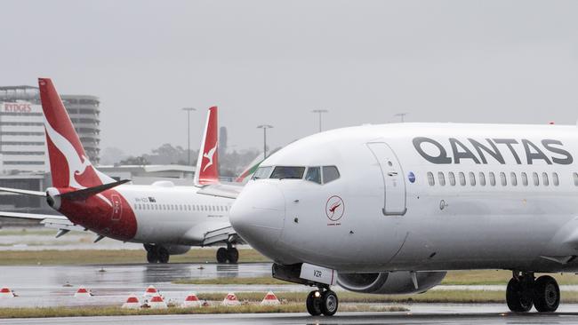 Qantas aircraft taxi at Sydney Airport. Picture: NCA NewsWire / James Gourley