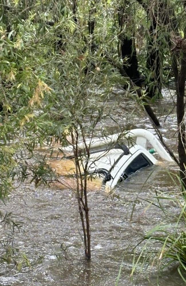 A ute has been fully submerged in flood water at Yengarie.