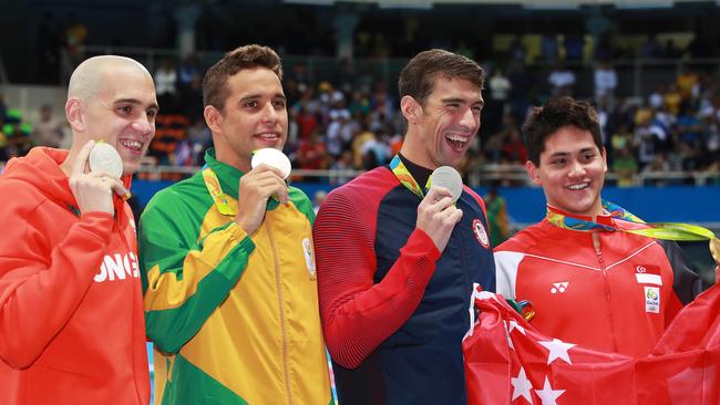 Laslo Cseh, Chad le Clos and Michael Phelps hold their silver medals, while Joseph Schooling celebrates Singapore’s maiden gold medal at an Olympic Games. Picture. Phil Hillyard