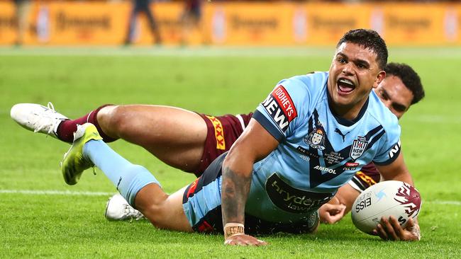 Latrell Mitchell celebrates after a try in game two in Brisbane. Picture: Chris Hyde / Getty Images