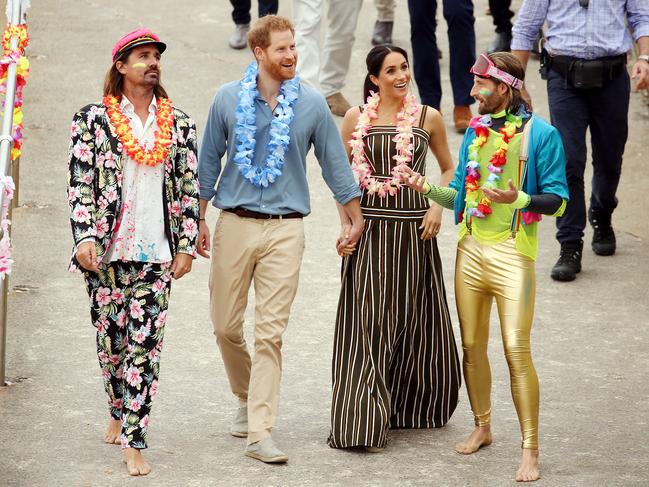 Prince Harry and his wife Meghan Markle are greeted at Bondi Beach. Picture: Tim Hunter