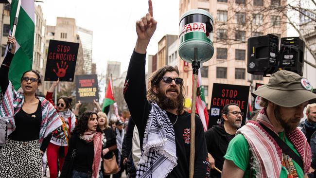 Pro-Palestine activists protest against the war in Gaza during a street march in Melbourne on Sunday. Picture: NewsWire