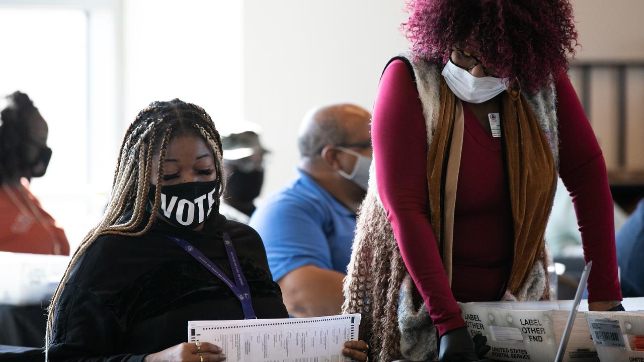 Workers process absentee ballots at Georgia’s State Farm Arena on November 6. Picture: Jessica McGowan/Getty Images/AFP