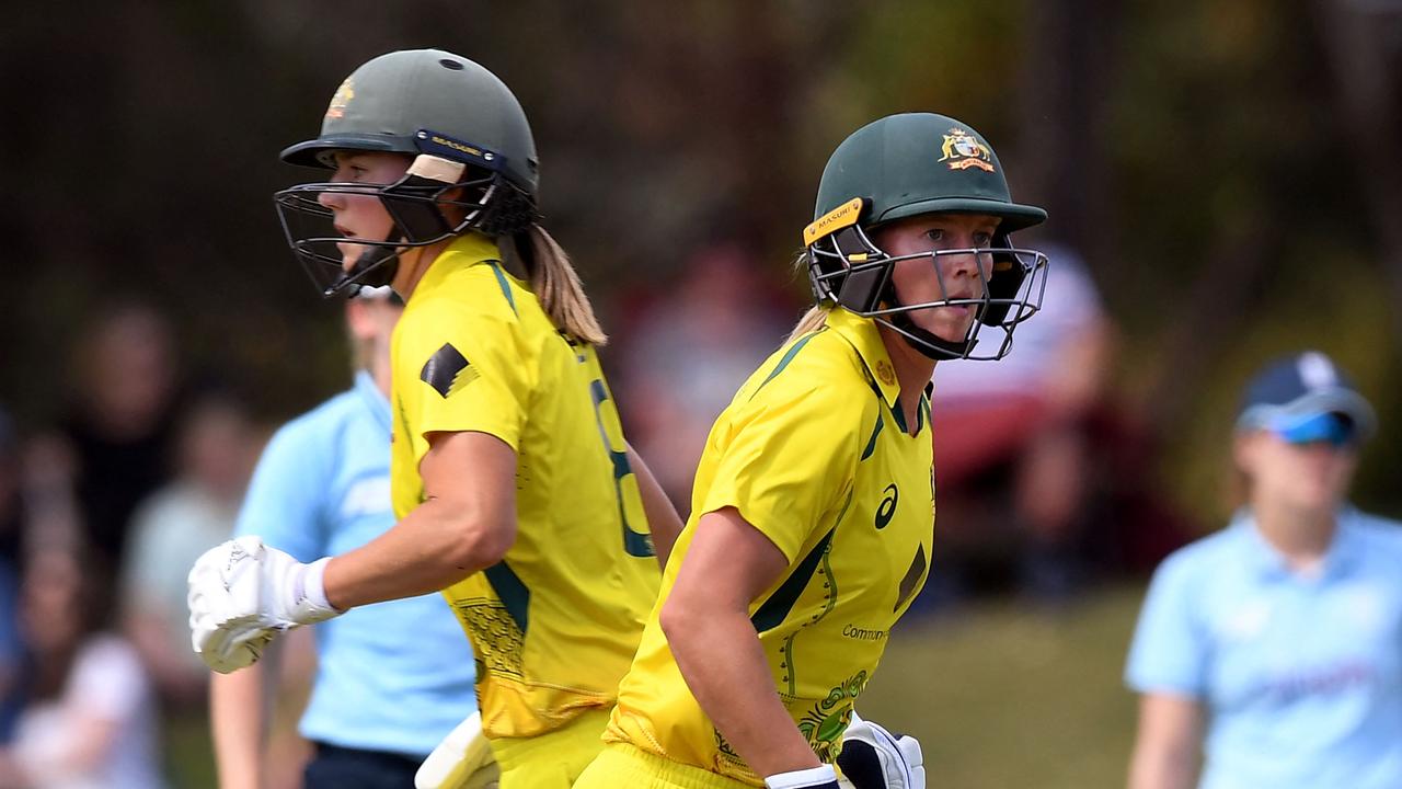 Australia's Meg Lanning (R) and Ellyse Perry (L) take runs during the women's one-day international cricket match between Australia and England in Melbourne on February 8, 2022. (Photo by William WEST / AFP) / -- IMAGE RESTRICTED TO EDITORIAL USE - STRICTLY NO COMMERCIAL USE --