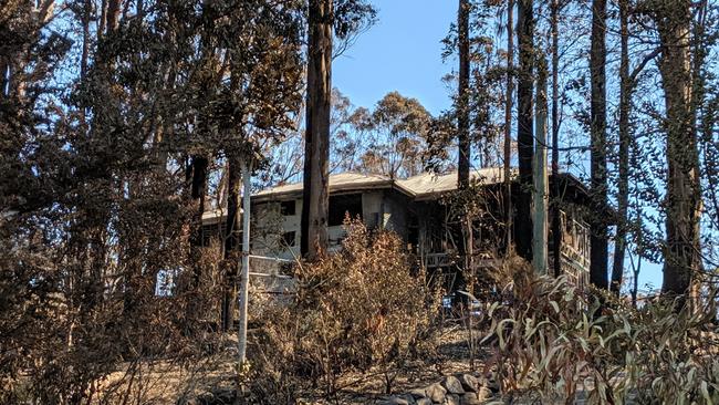 A charred home at Beechmont after a massive bushfire swept through the area in 2019. Picture: Luke Mortimer.