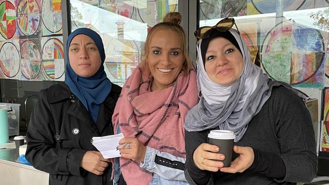 Wollongong Public School Community Hub volunteers Nesrin Shaaban, Evoon Yacoub and Kawther Daken serving up coffees. Picture: Dylan Arvela