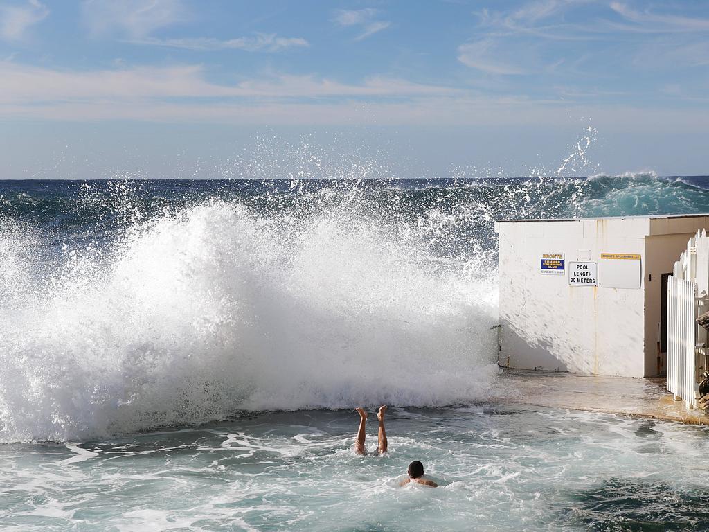 Swimmers have fun with the large swell at Bronte Beach. Picture: Daniel Aarons