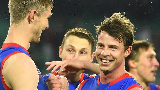 Tim English and Mitch Hannan celebrate winning their elimination final against Essendon.