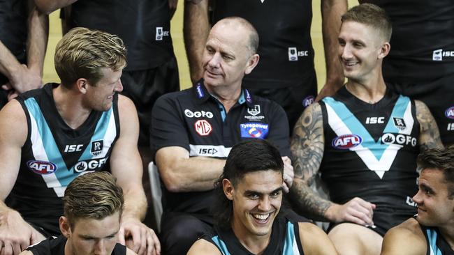 AFL - Port Adelaide Photo Day at Alberton Oval. Ken Hinkley talking to his captain Tom Jonas with vice captain Hamish Hartlett on the right Picture SARAH REED