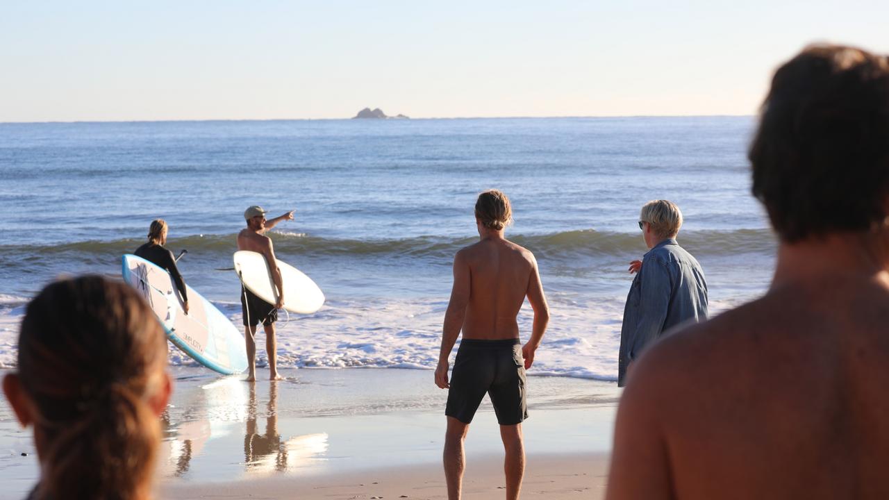 Members of the public took part in a paddle-out at Byron Bay's Main Beach to protest against the planned Netflix reality show Byron Baes on the morning of Tuesday, April 20, 2021. Picture: Liana Boss