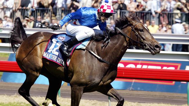 Where history began: Makybe Diva and Glen Boss win their first of three successive Melbourne Cups.