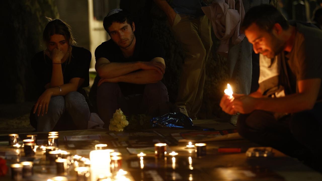 Members of the Jewish community light candles during a vigil for Israel at Downing Street in London. Picture: Peter Nicholls/Getty Images