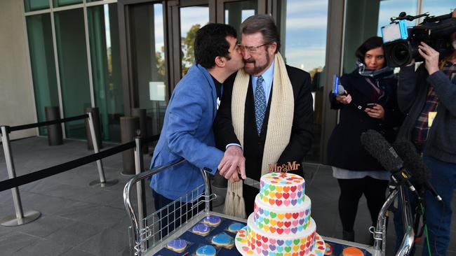 Labor senator Sam Dastyari plays up to independent senator Derryn Hinch after cutting a ‘marriage equality cake’ at Parliament House in Canberra yesterday. Picture: AAP