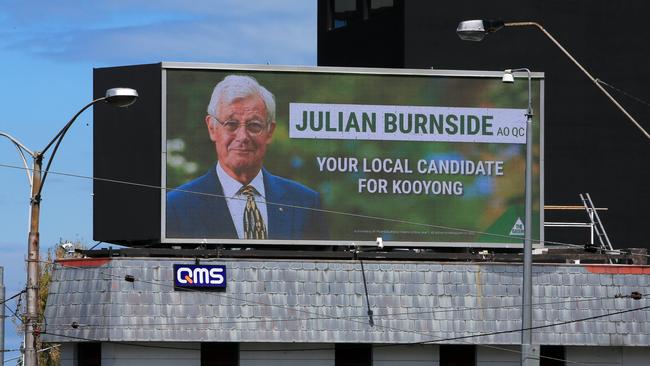 The competing electronic billboard in Kew Junction featuring Greens candidate Julian Burnside. Picture: Aaron Francis 