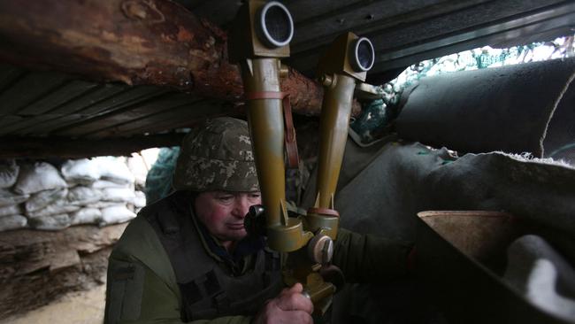 An Ukrainian serviceman on the frontline with Russia-backed separatists in the Donetsk region on Tuesday. Picture: AFP