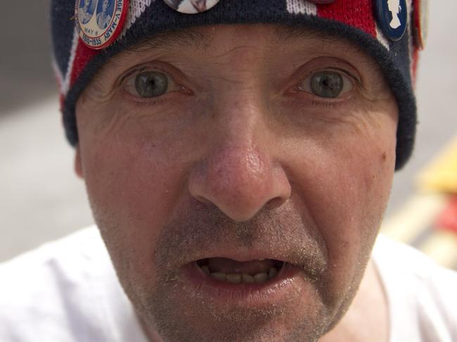 Royal fan John Loughrey poses for photographs outside the Lindo Wing of St Mary's Hospital, London, Friday, April 17, 2015. Britain's Kate the Duchess of Cambridge is expected to give birth to her second child with her husband Prince William at the hospital in the coming weeks. (AP Photo/Matt Dunham)