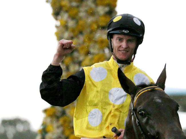 Jockey Zac Purton riding In Her Time gestures after winning Race 8, The Galaxy, during the Longines Golden Slipper Day at Rosehill Gardens Racecourse in Sydney, Saturday, March 24, 2018. (AAP Image/Jeremy Ng)