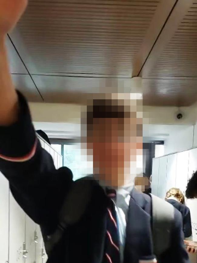 A screenshot taken from a video sourced from a parent at Cranbrook High School showing a boy performing the the sieg heil (Nazi salute) and believed to be taken on June 3 2022. Image: supplied