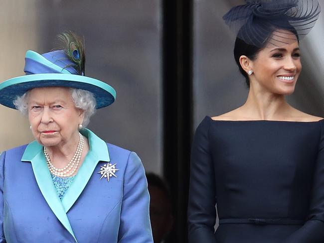 LONDON, ENGLAND - JULY 10: Queen Elizabeth II, Prince Harry, Duke of Sussex and Meghan, Duchess of Sussex on the balcony of Buckingham Palace as the Royal family attend events to mark the Centenary of the RAF on July 10, 2018 in London, England. (Photo by Chris Jackson/Getty Images)