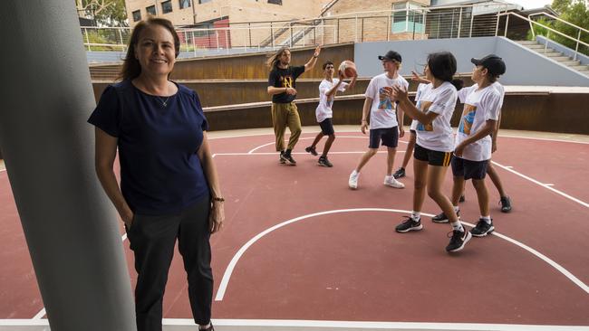 Kim Farmer with kids from the Polly Farmer Foundation in Lathlain, Perth. Picture: Ross Swanborough