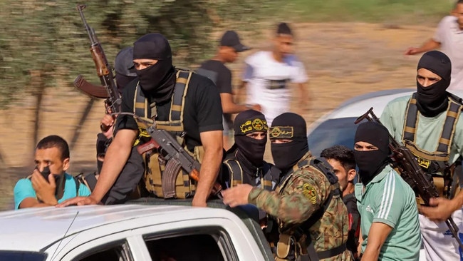 Hamas militants approach the Israeli border on October 7, 2023. The Albanese government has directly, if unintentionally, rewarded Hamas and its long history of anti-Semitic terrorism. Picture: Said Khatib/AFP/Getty Images