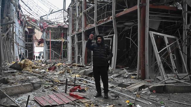 The war in Ukraine, including a drone strike damaging this Kharkiv shopping centre, doesn’t explain why our energy prices are so high. Picture: AFP