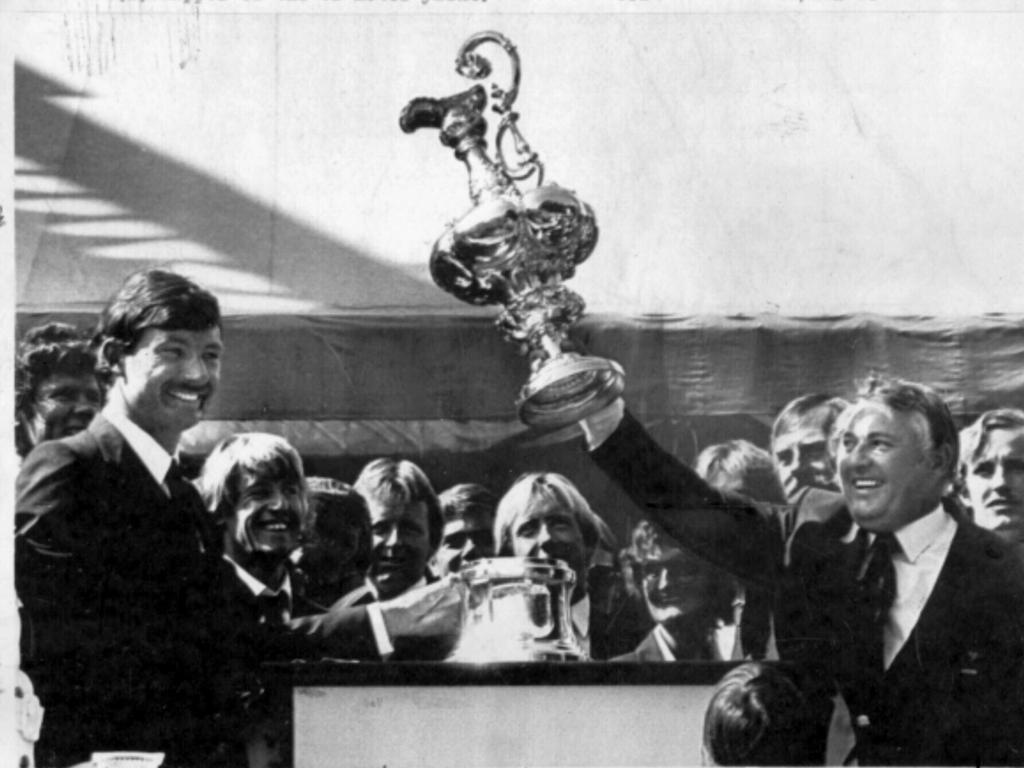 Yachtsman John Bertrand with Alan Bond holding Americas Cup trophy in 1983.