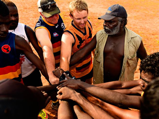## EMBARGO - DO NOT RUN BEFORE NOVEMBER 29th ## Yirrminhirnu Crows coach Cassima Narndu revs up his players prior to the Wadeye Football League match starting in the Northern Territory.
