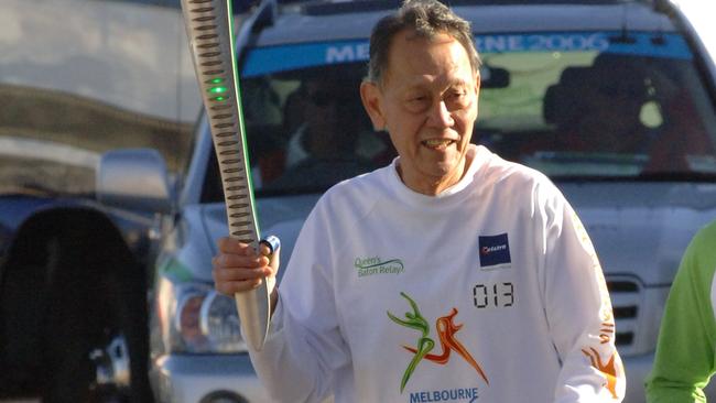 Richard Tann runs with the Queen’s Baton before the Commonwealth Games in Melbourne in 2006. Picture: Jessica O’Donnell