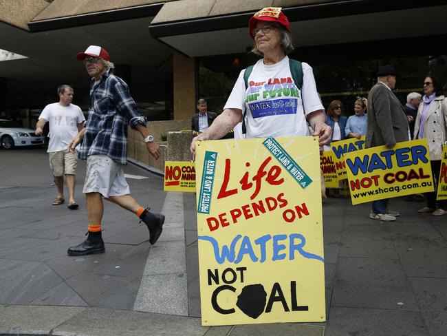 Members of the Southern Highlands community stand during a protest in Sydney.