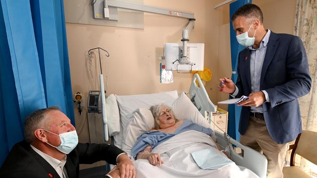 Premier Peter Malinauskas toured the Mount Gambier Hospital with independent MP Troy Bell (left) and they spoke to patient Carmel Phelan, 79. Picture: Naomi Jellicoe