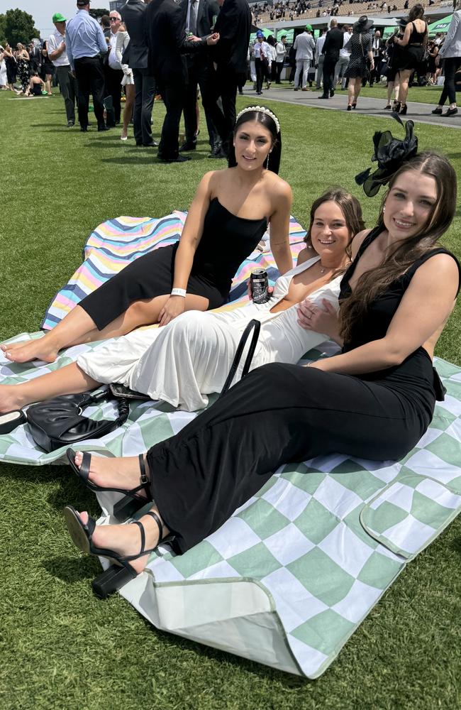 Claire Selvaggio, Holly Mussett and Desiree Gannan at Flemington for Derby Day on November 2, 2024. Picture: Phillippa Butt