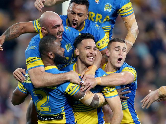 Corey Norman celebrates with his team after a try.